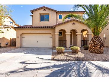 Charming two-story home with desert landscaping and an attached two-car garage at 3235 E Virgil Dr, Gilbert, AZ 85298