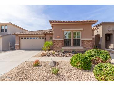 Charming single-story home with stone accents and a well-maintained desert-landscaped front yard at 35306 N 31St Dr, Phoenix, AZ 85086