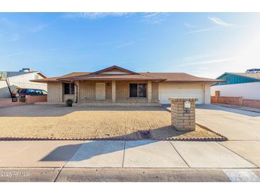 Charming one-story brick home with desert landscaping and a spacious driveway at 3635 W Cortez St, Phoenix, AZ 85029