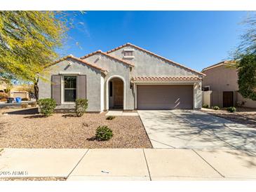 Charming single-story home with a two-car garage, desert landscaping, and a tile roof in a quiet neighborhood at 3781 S Pablo Pass Dr, Gilbert, AZ 85297