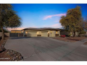 Charming single-story home featuring a three-car garage and mature trees at 5634 N 82 Ave, Glendale, AZ 85303