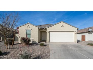 Charming single-story home featuring a two-car garage and well-maintained desert landscaping at 821 S Parker Pl, Casa Grande, AZ 85122