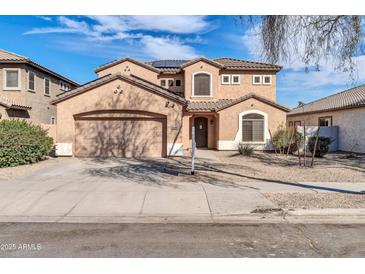 Charming two-story stucco home featuring a two-car garage and low maintenance landscaping at 17388 W Elaine Dr, Goodyear, AZ 85338