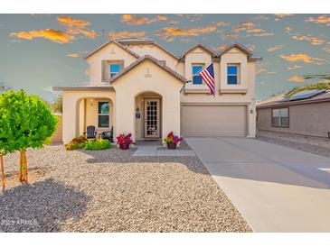 Charming two-story home featuring a well-manicured front yard and traditional design elements at 17722 N 183Rd Ave, Surprise, AZ 85374