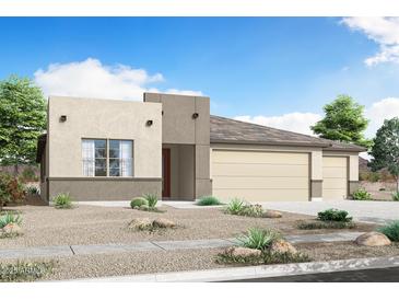 Modern home featuring a neutral color palette, low maintenance landscape, and a two car garage at 18429 W Mohave St, Goodyear, AZ 85338