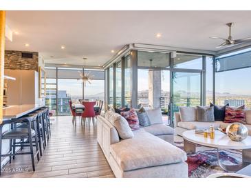 Bright and airy living room with floor-to-ceiling windows and modern furnishings at 7120 E Kierland Blvd # 1117, Scottsdale, AZ 85254