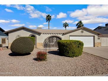 Charming single-story home featuring desert landscaping and a cozy courtyard entry at 1812 W Curry Drive Dr, Chandler, AZ 85224