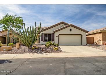 Charming home showcasing desert landscaping and an attached two-car garage at 41012 N Noble Hawk Way, Anthem, AZ 85086