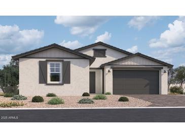 Charming single-story home featuring a neutral stucco facade, grey accents, and a two-car garage at 5515 W Hopi Trl, Laveen, AZ 85339