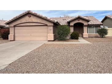 Charming single-story home with a two-car garage and well-kept desert landscaping at 60 W Shamrock St, Gilbert, AZ 85233