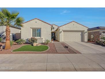 Charming single-story home with desert landscaping, two-car garage, and a welcoming entrance at 20012 W Campbell Ave, Buckeye, AZ 85396