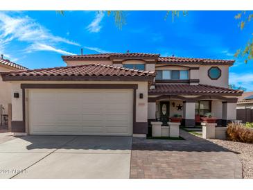 Charming two-story home with a tile roof, well-manicured lawn, and a two car garage at 28422 N 32Nd Ln, Phoenix, AZ 85083