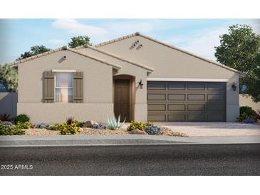 Charming single-story home featuring a two-car garage and desert landscaping at 24509 W Grenadine Rd, Buckeye, AZ 85326