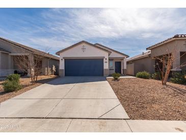 Charming single-story home with a two car garage and low-maintenance landscaping at 36529 W San Capistrano Ave, Maricopa, AZ 85138