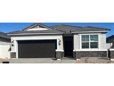 Beautiful single-story home featuring a two-car garage and neutral-toned facade at 25326 W Sunland Ave, Buckeye, AZ 85326