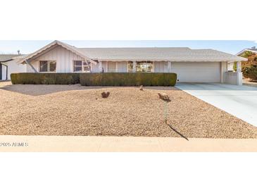 Charming single-story home with well-maintained front yard and neutral colored exterior at 10809 W El Dorado Dr, Sun City, AZ 85351