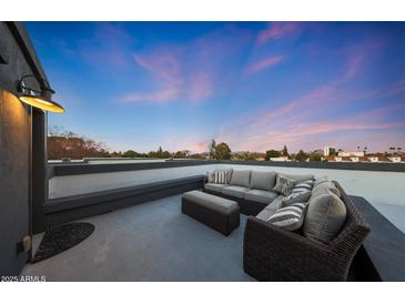 Stylish rooftop deck featuring comfortable seating and panoramic views for relaxing and entertaining at 240 W Missouri Ave # 13, Phoenix, AZ 85013