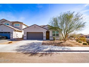 Charming single-story home with a well-manicured front yard and two car garage at 3029 S 78Th Dr, Phoenix, AZ 85043