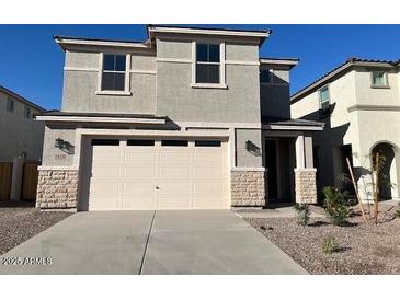 Charming two-story home featuring a modern design, neutral color palette, and a two-car garage at 7418 W Rovey Ave, Glendale, AZ 85303