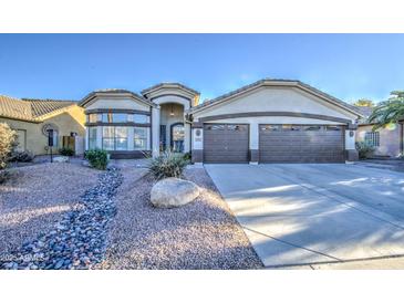 Charming single-story home with desert landscaping, a two-car garage, and a welcoming entrance at 835 W Beechnut Dr, Chandler, AZ 85248