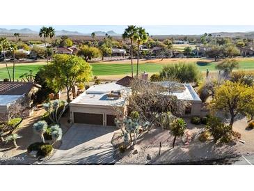 Beautiful aerial view of this desert home, showcasing its unique architecture and desert landscaping at 18919 E Reata Ln, Rio Verde, AZ 85263