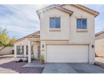 Charming two-story home with neutral stucco and tile roof at 9405 W Palmer Dr, Peoria, AZ 85345