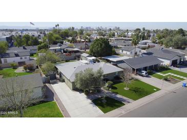 Wide aerial shot showcasing a neighborhood with well-maintained homes and landscaping at 1335 E Oregon Ave, Phoenix, AZ 85014