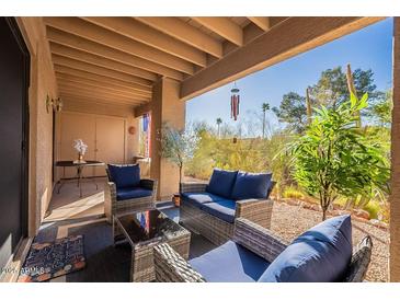 Inviting outdoor patio with comfortable seating, perfect for relaxing and enjoying the desert scenery at 14910 N Kings Way # 101, Fountain Hills, AZ 85268