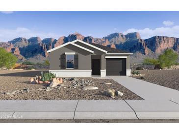 Charming single-story home featuring desert landscaping, attached garage, and stunning mountain views at 35436 N Breezy Ln, San Tan Valley, AZ 85140