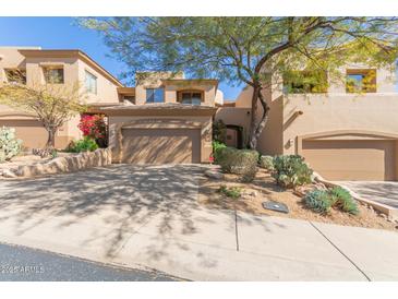 Attractive home featuring a two-car garage and desert landscaping in front at 9715 N Azure Ct # 4, Fountain Hills, AZ 85268