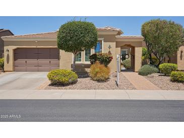 Charming single-story home featuring desert landscaping, gated front entry and attached two-car garage at 12956 W Eagle Ridge Ln, Peoria, AZ 85383