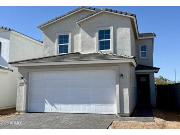 Charming two-story home featuring a spacious two-car garage and a well-maintained front yard at 1588 N Pueblo Dr, Apache Junction, AZ 85120