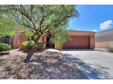 Front of single-story home with desert landscaping, driveway and two-car garage at 43573 W Blazen Trl, Maricopa, AZ 85138