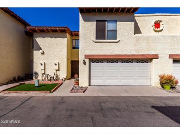 Charming condo featuring an attached garage and quaint front patio area at 5726 N 10Th St # 5, Phoenix, AZ 85014