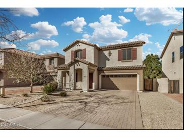 Charming two-story home with a two-car garage and beautiful desert landscaping at 1998 S Starling Dr, Gilbert, AZ 85295