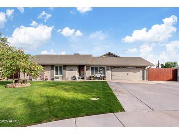 Charming single-story home featuring a well-manicured lawn, a 2-car garage, and delightful curb appeal at 2747 S Brooks --, Mesa, AZ 85202