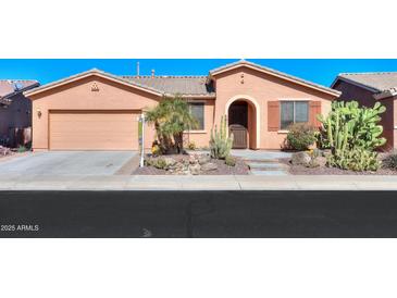 Charming single-story home with desert landscaping, complemented by a two-car garage at 42432 W North Star Dr, Maricopa, AZ 85138