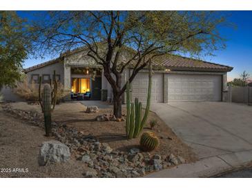 Charming desert home with a low-maintenance yard, mature trees and spacious three-car garage at 4665 S Palacio Way, Gold Canyon, AZ 85118