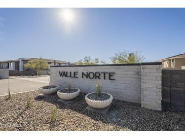 Valle Norte community signage featuring a stone wall and succulent landscaping at 2121 W Sonoran Desert Dr # 13, Phoenix, AZ 85085