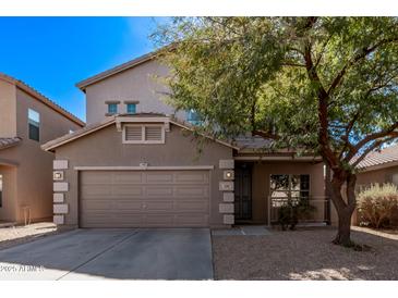 Charming two-story home featuring a two-car garage and a well-manicured front yard, offering great curb appeal at 3595 E Desert Moon Trl, San Tan Valley, AZ 85143