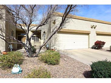 Charming single-story home featuring a two-car garage and desert landscaping in a well-maintained community at 6730 E Hermosa Vista Dr # 20, Mesa, AZ 85215