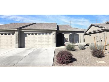 Charming single-story home featuring a two-car garage and well-maintained landscaping at 3117 S Signal Butte Rd # 480, Mesa, AZ 85212