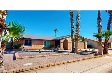 Charming single-story home with brick accents and well-maintained desert landscaping at 3215 N Margate Pl, Chandler, AZ 85224