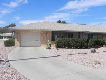 Charming single-story home featuring a two-car garage, low-maintenance landscaping, and a welcoming facade at 9806 W Long Hills Dr, Sun City, AZ 85351