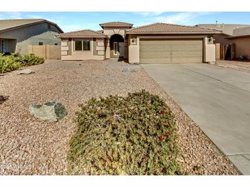 Charming single-story home with desert landscaping and a two-car garage in a peaceful community at 16370 W Rimrock St, Surprise, AZ 85388