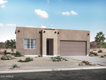 A modern single-story home showcases desert landscaping and neutral tones, under a blue sky at 4157 W Eli Dr, San Tan Valley, AZ 85144