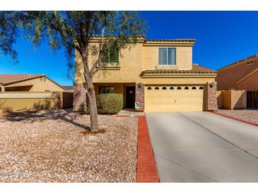 Charming two-story home featuring a two car garage and desert landscaping at 468 E Wolf Hollow Dr, Casa Grande, AZ 85122