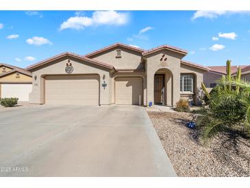 Charming single-story home featuring a three-car garage, desert landscaping, and a welcoming facade at 860 E Cierra Cir, San Tan Valley, AZ 85143