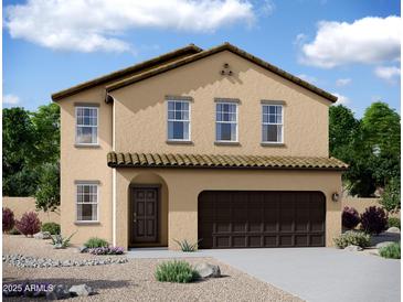 Charming two-story home with a tile roof and two-car garage offers inviting curb appeal at 9808 W Agora Ln, Tolleson, AZ 85353