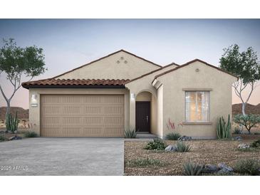 Charming single-story home featuring a desert landscape, neutral stucco, and a two-car garage at 42855 W Vincent Dr, Maricopa, AZ 85138